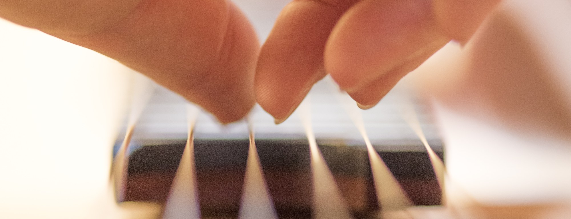 Close-up of Yuri Liberzon's right hand on the strings at the soundhole