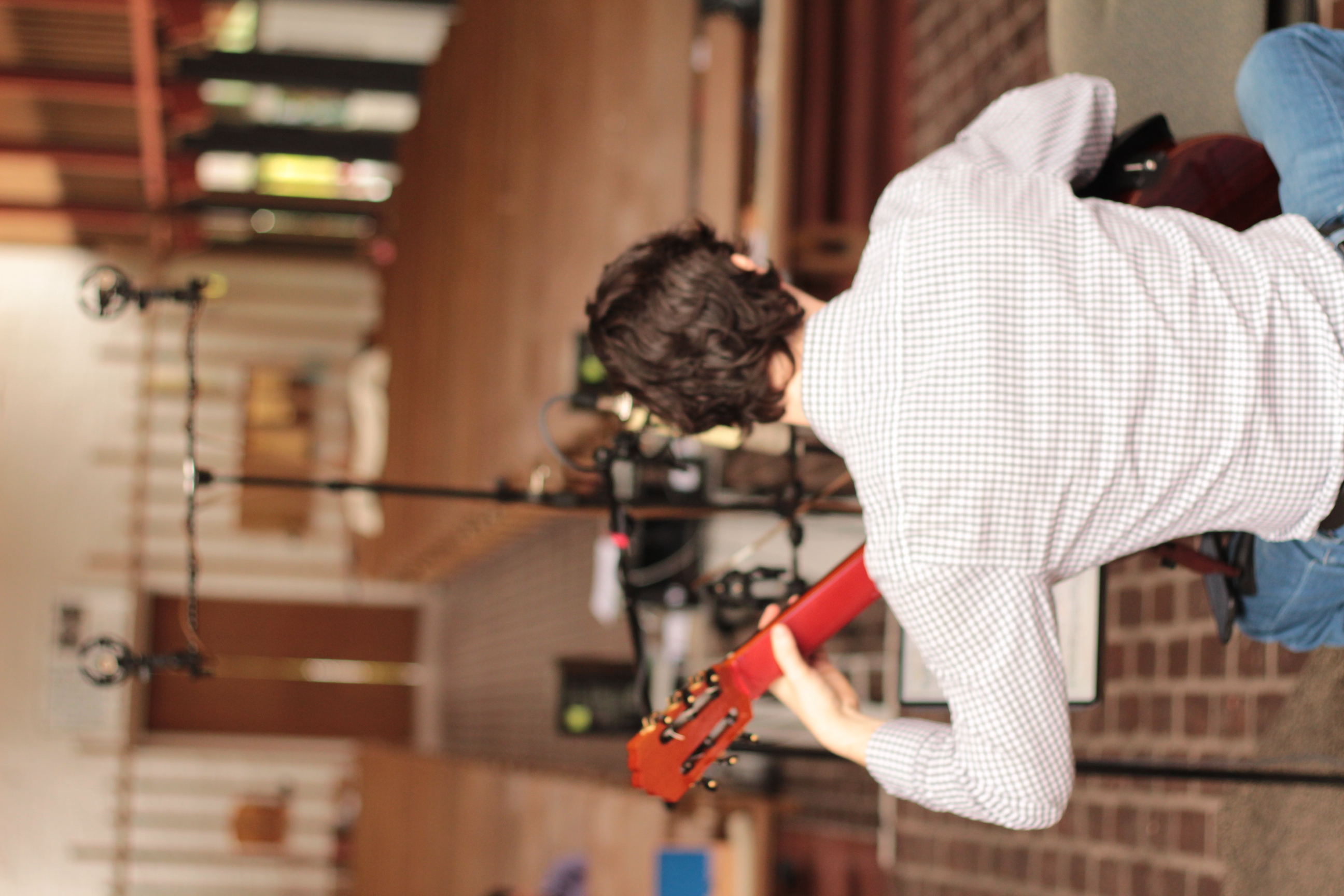 The recording room behind Yuri Liberzon as he plays guitar during the Bach session.