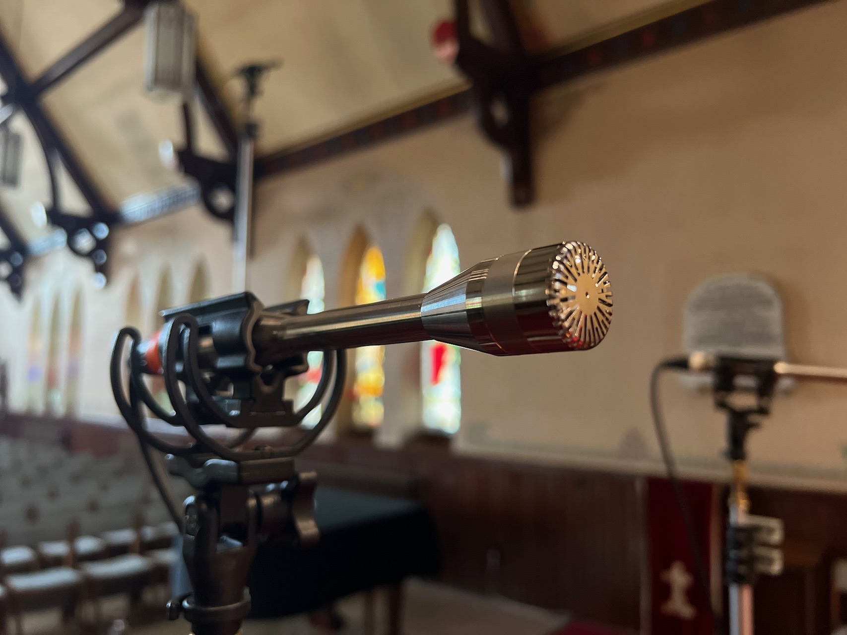 Close-up of a microphone against the church windows during the Piazzolla album sessions
